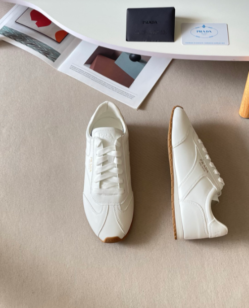Prada white low-profile lace-up sneakers with dark toe trim