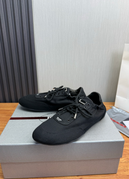 Prada black lace-up sneakers with black eyelets
